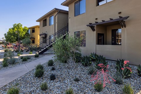 a view of the front of a house with a garden in front of it a view of the front of a house with a garden in front of it  at Polo Villas, California, 93312